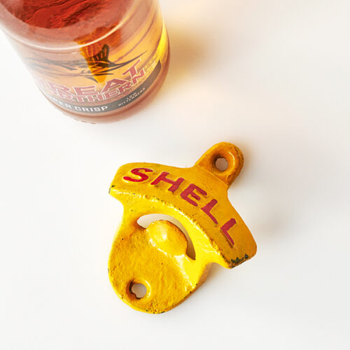 Shell wall mounted bottle opener